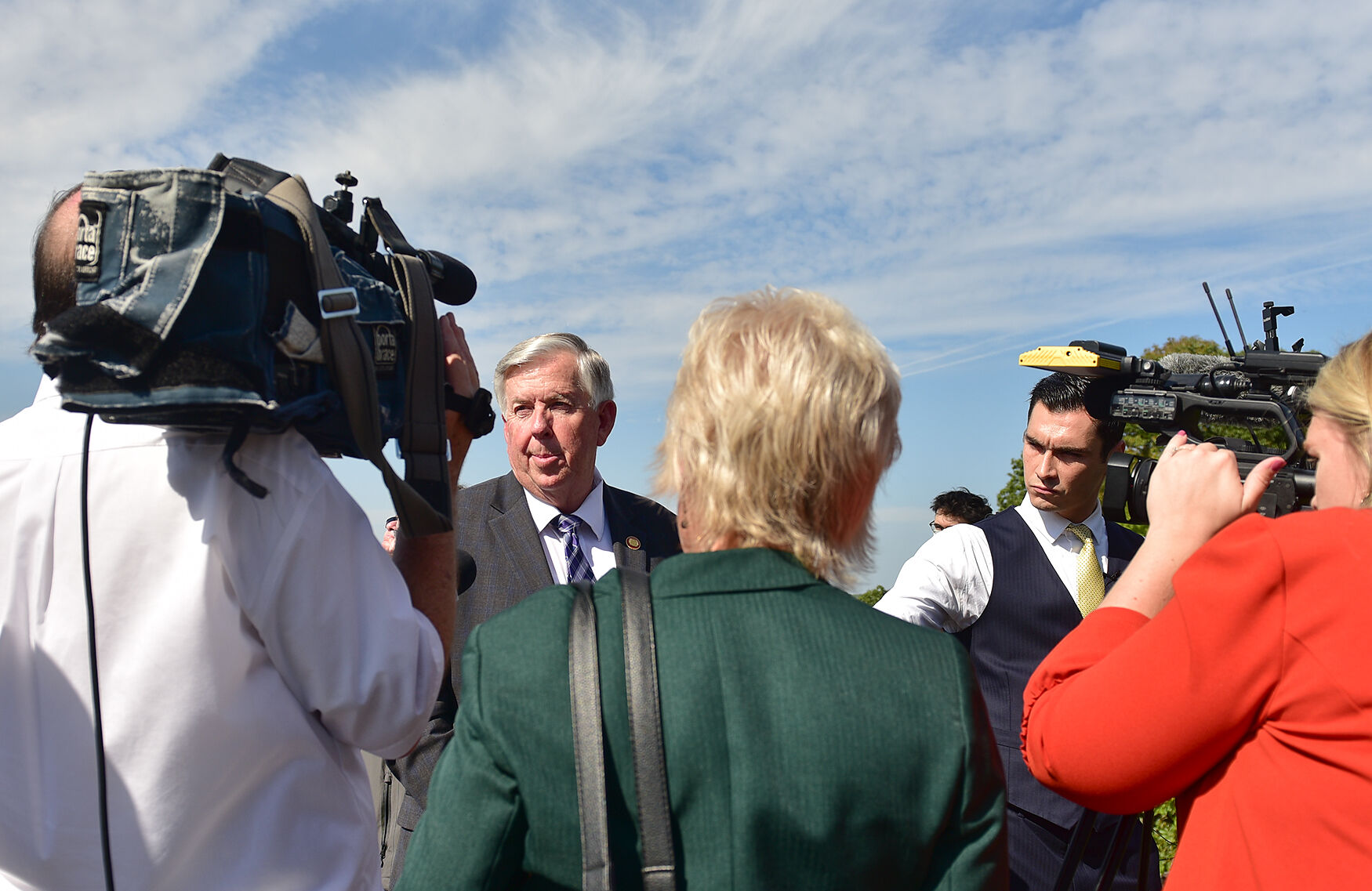 Gov. Mike Parson talks to the media after the I-70 Bridge groundbreaking ceremony